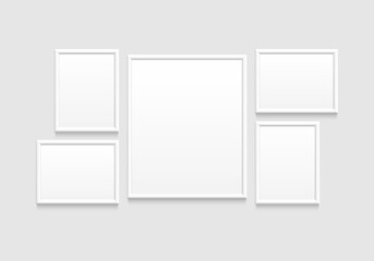 realistic blank frames mockup hanging on wall