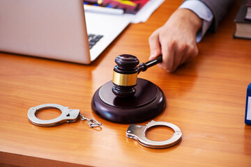 Young male lawyer sitting in the office