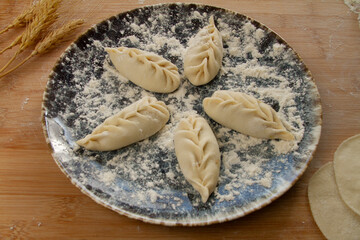 Freshly wrapped dumplings close up. Chinese food.