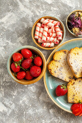 top view delicious cake slices with fruits on light background fruit cake sweet pie