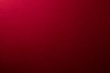 光が当たった赤い紙