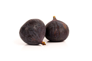 two whole sweet fig fruits isolated on white background