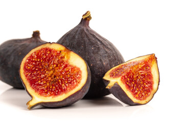 whole and sliced ripe sweet fig fruits isolated on white background