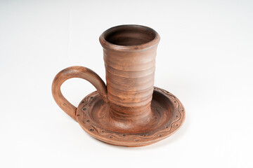 Pottery Craft, ceramic product with your own hands, made on a Potter's wheel, isolated on a white background.