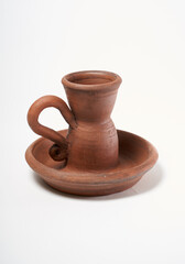 Pottery Craft, ceramic product with your own hands, made on a Potter's wheel, isolated on a white background.