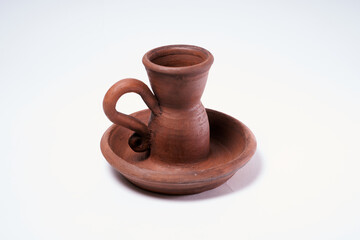 Pottery Craft, ceramic product with your own hands, made on a Potter's wheel, isolated on a white background.