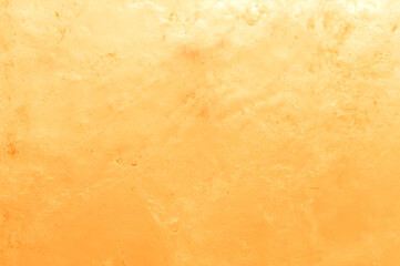 Salt lamp. The texture of the salt lamp, rock orange, close up. Blurred background