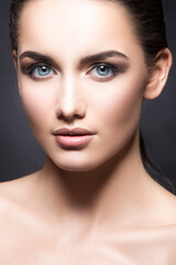 Beautiful face of young caucasian beauty model woman with perfect health fresh skin, eye shadow make-up - isolated on grey. Skincare facial treatment concept