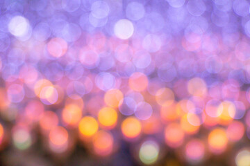 Fototapeta premium Colorful abstract bokeh blur defocus background.Bokeh background for festival season.Gold bokeh blur defocus in black