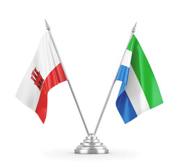 Sierra Leone and Gibraltar table flags isolated on white 3D rendering