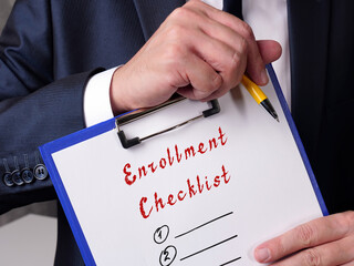  Financial concept meaning Enrollment Checklist with inscription on the page.