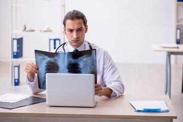 Young male doctor radiologist working in the clinic