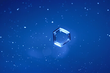 blue ice glass background, abstract texture of the surface of the ice on the glass, frozen seasonal water