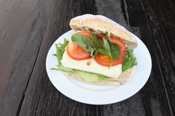 Ciabatta roll with tomato and mozzarella cheese