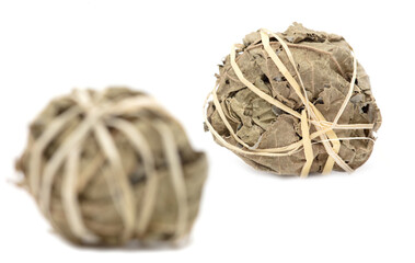 Close up of balls of dried tea leaves