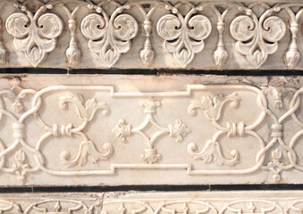 Ancient carving with floral ornament on marble in Taj Mahal, India