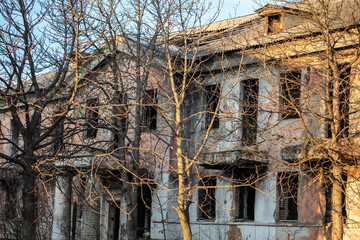 Old house in the rays of the sunset. Background