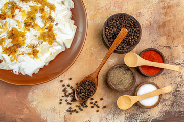top view different seasonings with dough slice meal on cream desk pepper spicy salt food