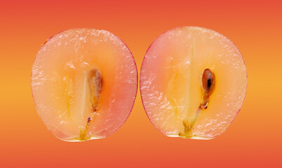 Red grapes in a cut isolated on a red background.