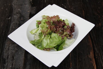 White bowl with fresh greens