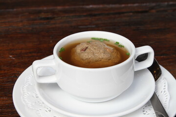 Beef consomme with liver dumpling. Bavarian Austrian food