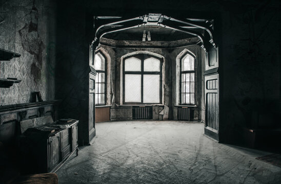 An old hall in an abandoned manor. Beautiful interior in an abandoned building.