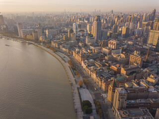 Aerial view of the bund and modern skyline in Shanghai, China, at sunrise.