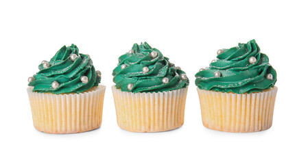 Tasty Christmas cupcakes on white background