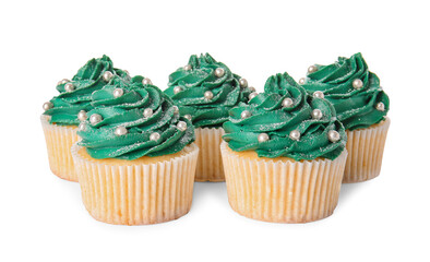 Tasty Christmas cupcakes on white background