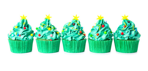 Tasty Christmas cupcakes on white background