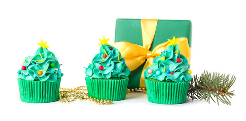 Tasty Christmas cupcakes on white background