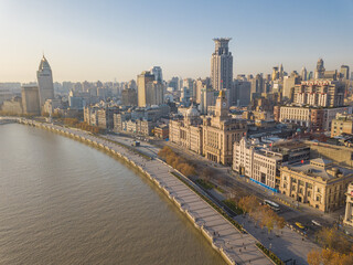 Aerial view of the bund and modern skyline in Shanghai, China, at sunrise.