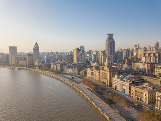 Aerial view of the bund and modern skyline in Shanghai, China, at sunrise.