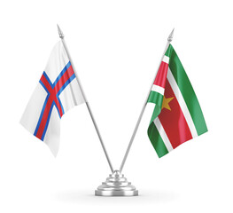 Suriname and Faroe Islands table flags isolated on white 3D rendering