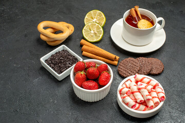 front view cup of tea with biscuits and sweets on dark background sweet photo cookie