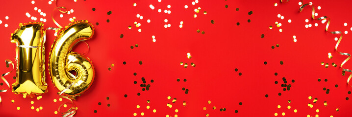 Gold foil balloon number, digit sixteen. Birthday greeting card, inscription 16. Anniversary celebration event. Banner. Stylish golden numeral, light bokeh, glitter, red background. Numerical digit