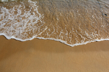 Sand beach and spume