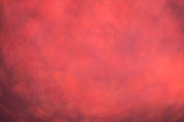Red blurry background shiny bokeh.