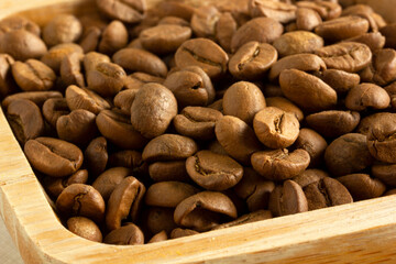 coffee beans on wooden plate