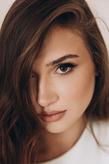 Obraz premium Beautiful girl in a dress on a fashion photoshoot in a photostudio