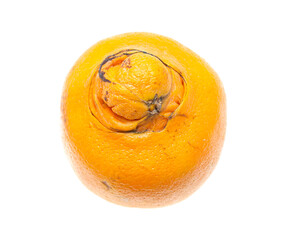 an orange with an external defect on a white background
