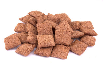 chocolate pillows for breakfast isolated on white background. Brown choco cereal pads with cream