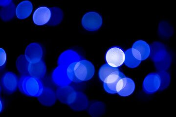 Perfect bokeh for a festive New Year and Christmas background. Defocused abstract blue light circles