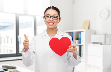 medicine, cardiology and healthcare concept - happy smiling asian female cardiologist doctor or...