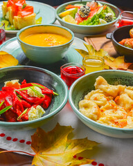 Traditional ukrainian food in assortment in festive decorating. Seasonal autumn menu served on table.