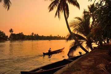 A boat sailing on Kerala backwaters - obrazy, fototapety, plakaty
