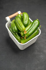 front view fresh green cucumbers inside basket on a dark background salad meal food health color photo