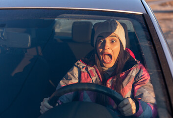 Portrait of a frightened woman screaming a few seconds before the car collided.