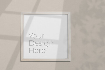 Mockup blank wooden photo frame with tree leaves  and window shadow overlay