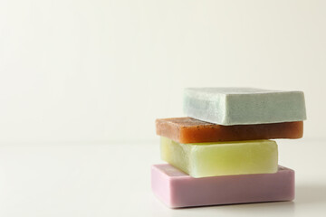 Pile of natural soap on white background